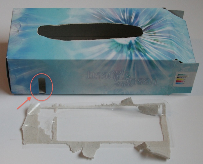 The tissue box of Albert Heijn has a large plastic foil glued to the inside of the box to cover the tiny window.